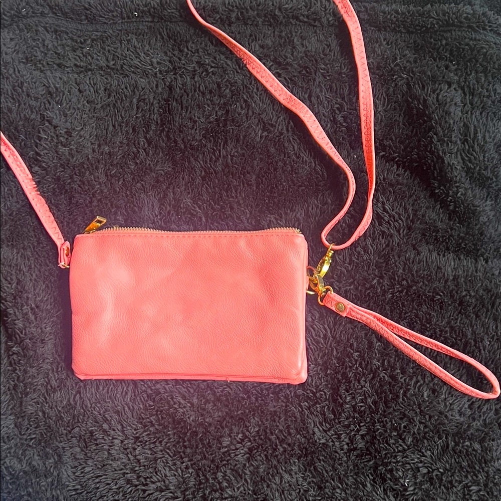 Peach/coral  Crossbody Bag
Gold hardware 
3 zipper pockets